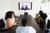 Best headsets for conference calls: people on a video call in a conference room
