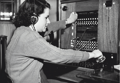 Woman using USB headset at work